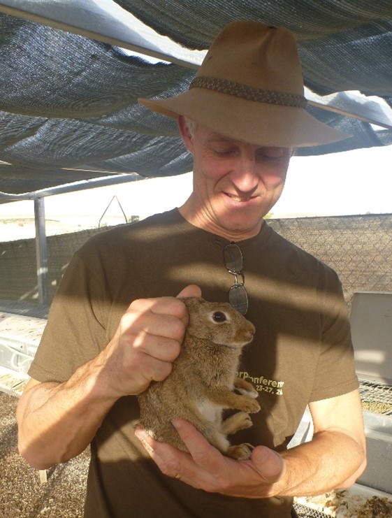 Greg Mutze holding rabbit